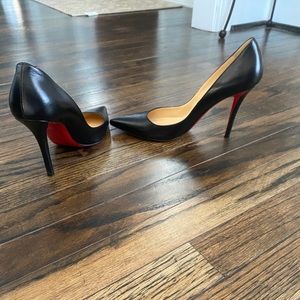 Christian Louboutin Black leather heels.